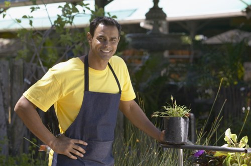 Gardeners applying health and safety procedures at work
