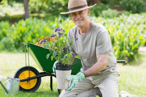 Local Gardeners Bankside working on seasonal garden upkeep